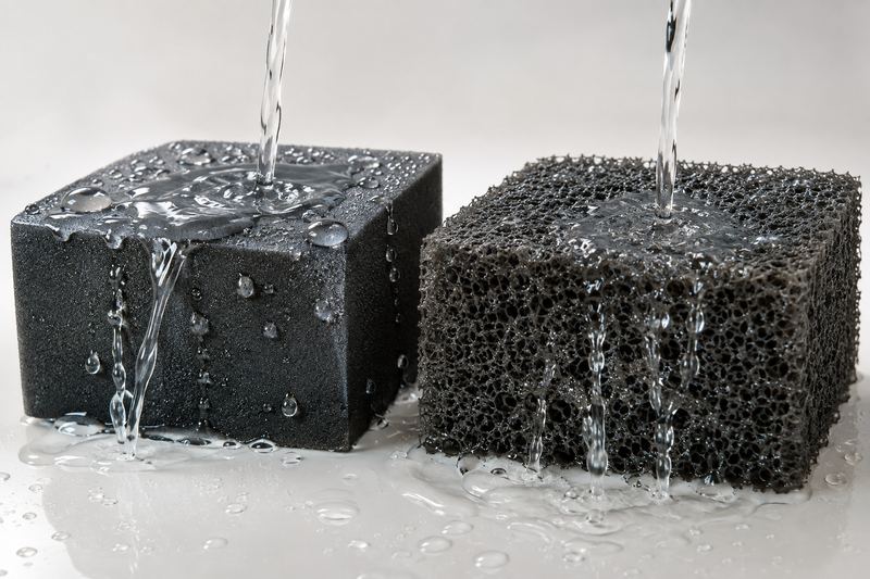 Closed-cell and open-cell foam blocks with water poured on both