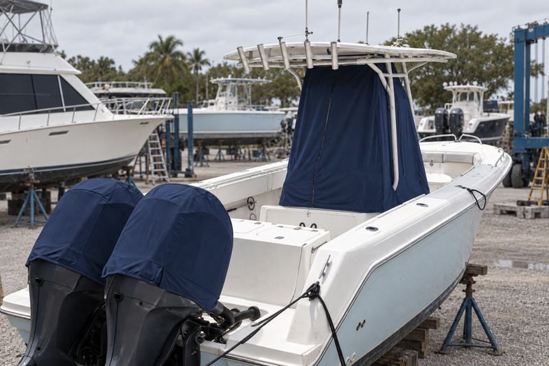 New fitted navy Sunbrella console cover and matching outboard covers
