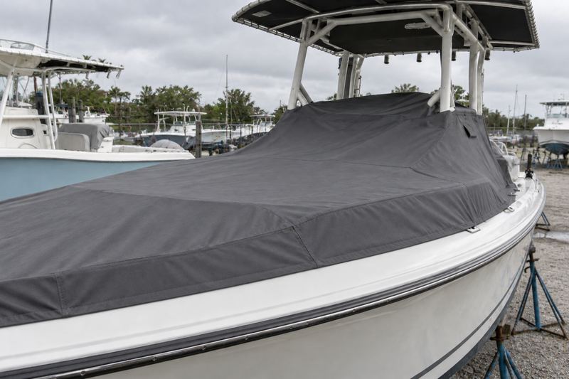 The same boat under a new fitted charcoal mooring cover with vents and snaps
