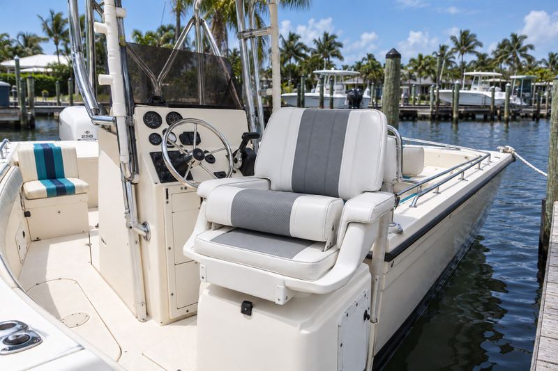 26 ft center console, new helm chair in white and grey perforated vinyl