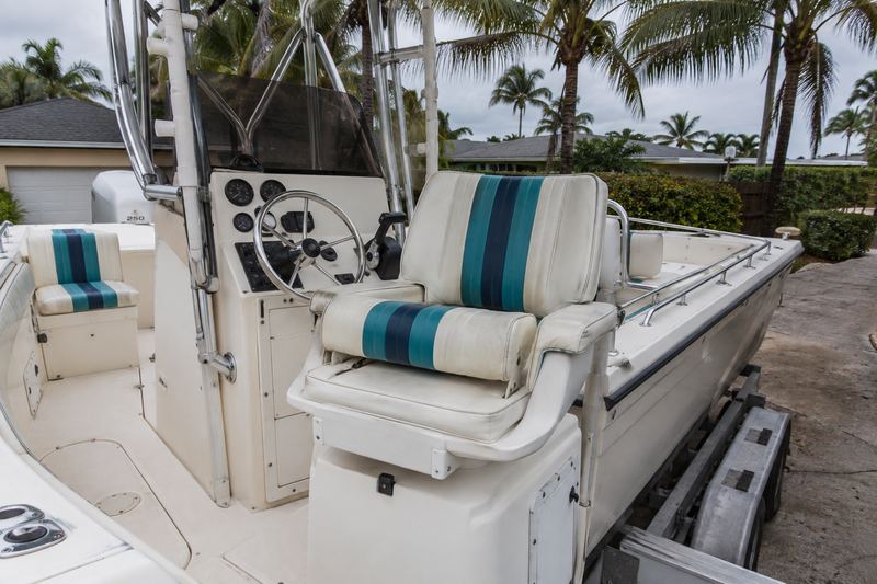 26 ft center console, worn helm seat upholstery
