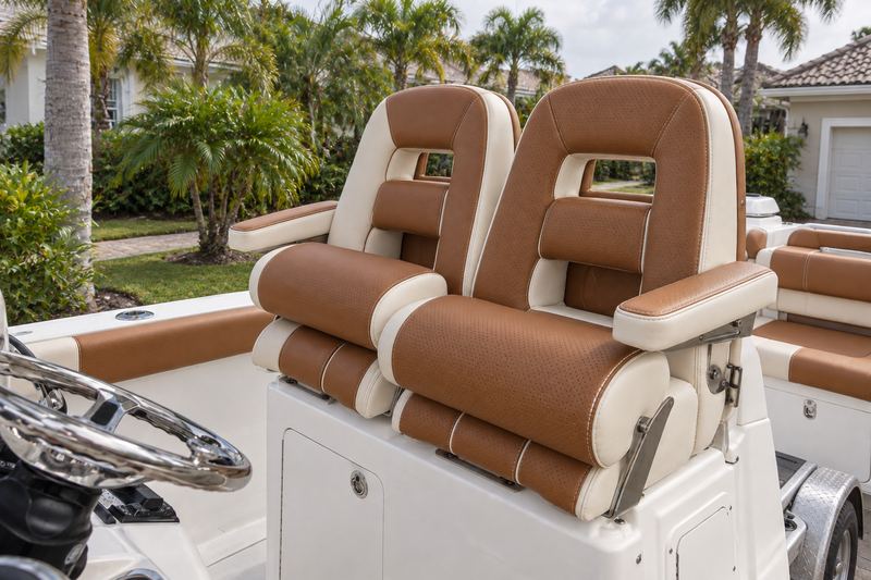 33 ft center console, new twin helm seats in cognac and cream perforated leather