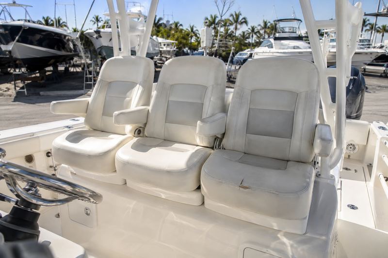 42 ft center console, worn helm seat upholstery