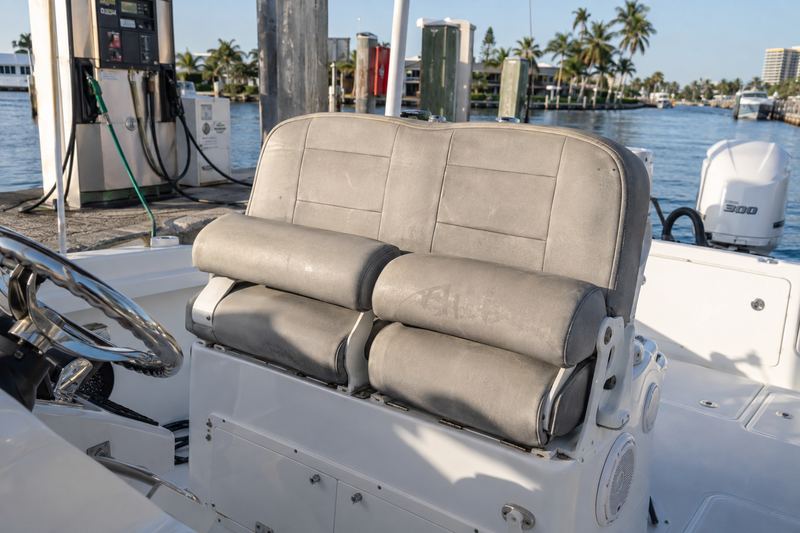 30 ft bay boat, worn helm seat upholstery