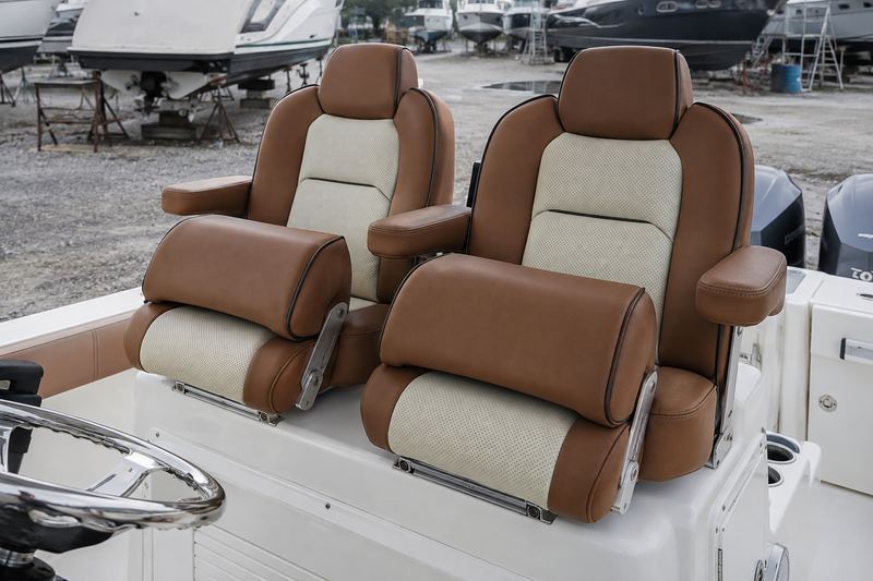 The same helm seats in cognac marine leather with cream perforated inserts and black piping
