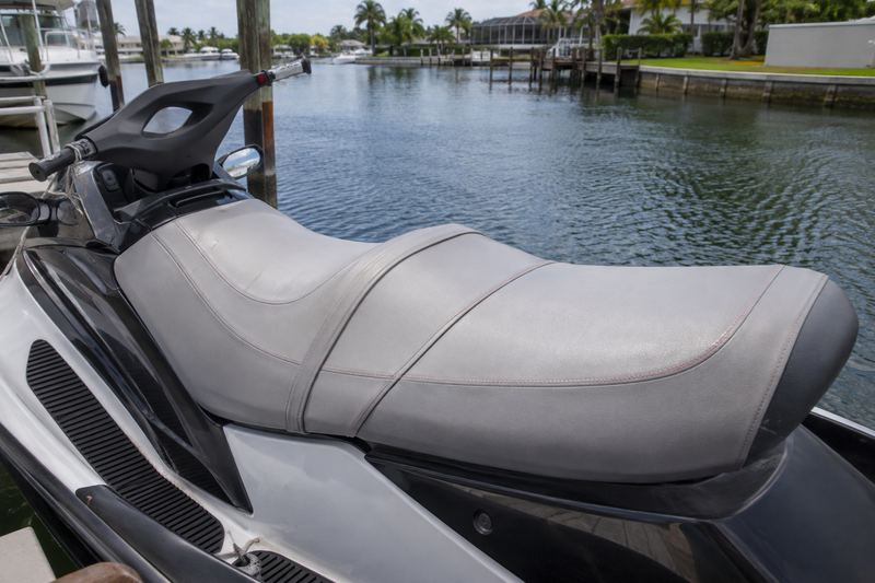 Two-seater jet ski, worn seat cover