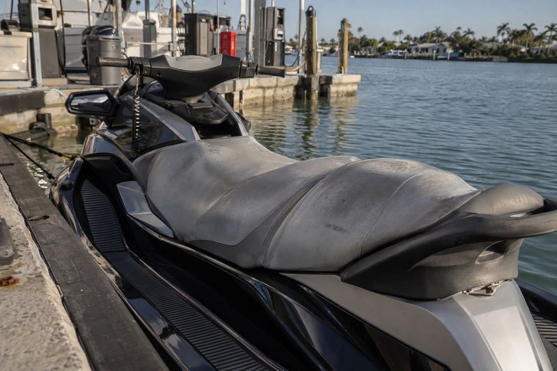 Jet ski on a lift, worn seat cover