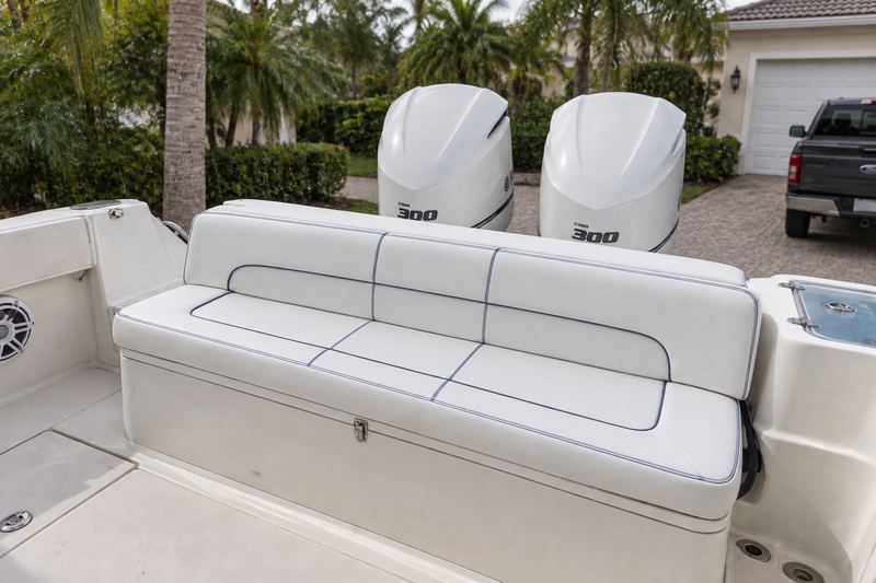 31 ft center console, new stern bench in ice white with navy channel stitching