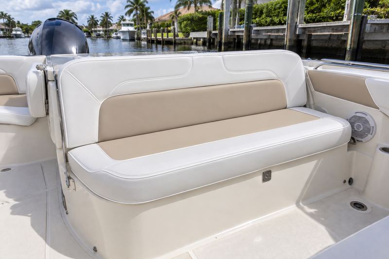 27 ft dual console, new rear bench in sand and white two-tone