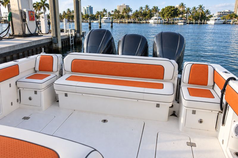 35 ft center console, new bench and jump seats in white with orange perforated inserts