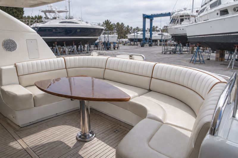 Yacht cockpit seating in orange perforated leather with cream piping